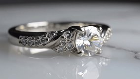 Elegant diamond engagement ring rotating slowly, showcasing brilliant sparkle and intricate design. Perfect for luxury jewelry ads or wedding proposals. - Powered by Shutterstock - Get 15% off with code: PIKWIZARD15