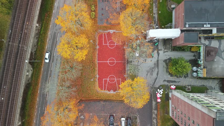 Drone shot of a basketball court in an urban area