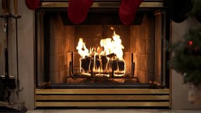 Cozy Christmas Fireplace with Twinkling Lights, Stockings, Firewood, and Festive Holiday Decor — Warm Winter Atmosphere for Seasonal and Holiday Content.                                                - Powered by Shutterstock - Get 15% off with code: PIKWIZARD15