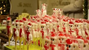 Row of Festive Snowman Candies at Christmas Market - Powered by Shutterstock - Get 15% off with code: PIKWIZARD15