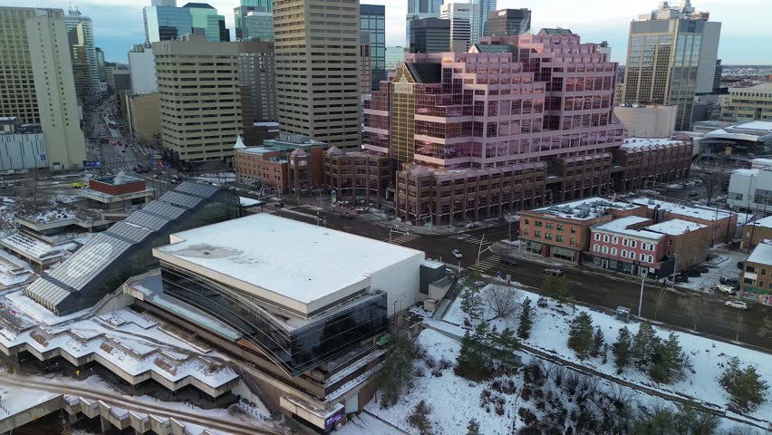 Edmonton skyline in winter captured from above, showing modern towers, snowy rooftops and a crisp North American urban atmosphere.