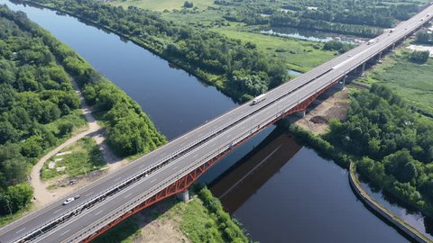 Drone Flying above Bridge Spanning River Valley