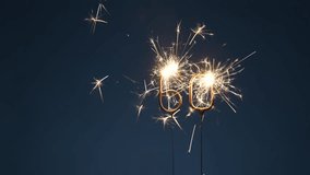 60 years anniversary celebration festive footage made with bengal fires in the form of number Sixty - Powered by Shutterstock - Get 15% off with code: PIKWIZARD15