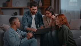 Multiethnic team four friends colleagues looking laptop on sofa diverse multiracial creative ethnic group people men women gathered at home party in casual office talking discussing online project - Powered by Shutterstock - Get 15% off with code: PIKWIZARD15