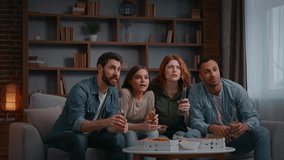 Overjoyed four multiracial friends watching football fans excited win watch tv television successful sport team triumph achieve diverse women men on home party enjoying soccer clinking bottles cheers - Powered by Shutterstock - Get 15% off with code: PIKWIZARD15