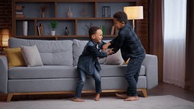 Two little African American boys fighting at home family children smiling laughing siblings brothers kids sons funny playing fight play game enjoyment happy childhood ticklish activity friendship - Powered by Shutterstock - Get 15% off with code: PIKWIZARD15