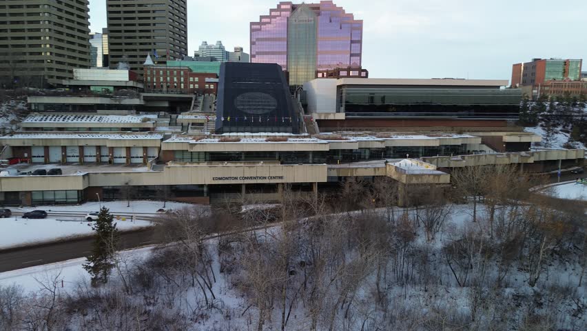 Winter aerial panorama of Edmonton with high towers, modern office buildings and a snowy urban environment.