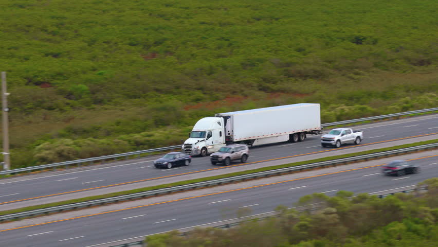 Long-haul semi truck transporting freight along a major American highway.