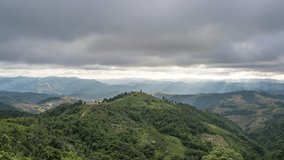 Stunning time-lapse sequence showcasing mountain vistas and natural landscape as the sun sets while dynamic clouds drift across the sky in Tak Province, Thailand. - Powered by Shutterstock - Get 15% off with code: PIKWIZARD15