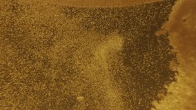 Abstract macro of bubbling liquid forming organic textures and flowing patterns, creating a hypnotic, golden visual surface. - Powered by Shutterstock - Get 15% off with code: PIKWIZARD15