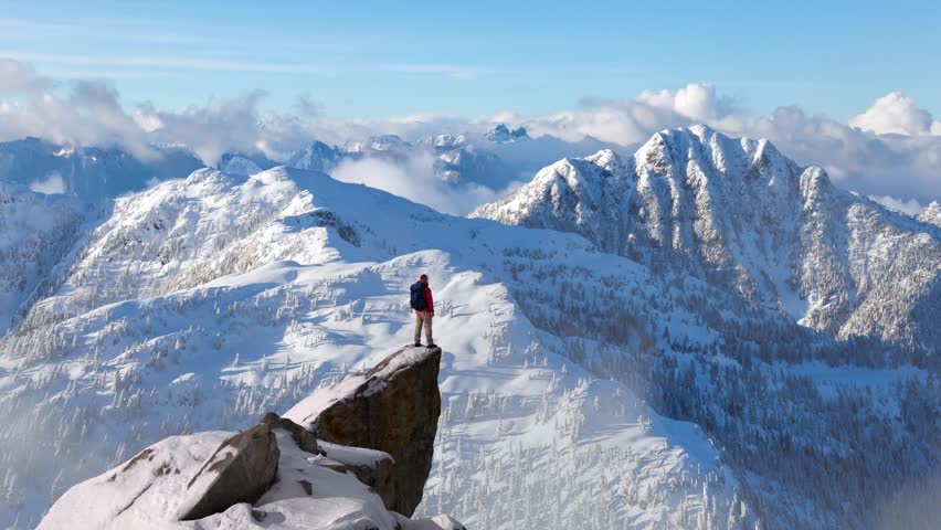 Hiker Stands Triumphantly on Snowy Mountain Peak, Enjoying the Vast Winter Landscape, 3D Render