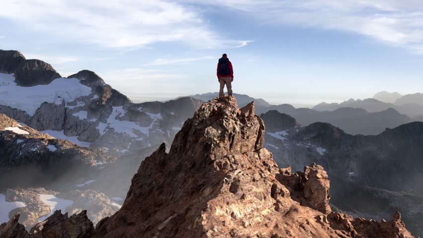 Adventurer on Mountain Peak Overlooking a Vast 3D Rendered Landscape