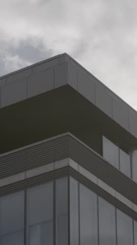 Modern building corner with cloudy sky, urban architecture, overcast mood