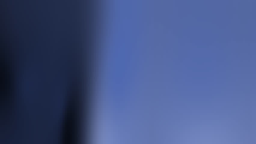 Abstract dark navy blue silk fabric background video loop featuring smooth metallic waves and elegant liquid motion perfect for luxury brand commercials and corporate presentation backdrops
