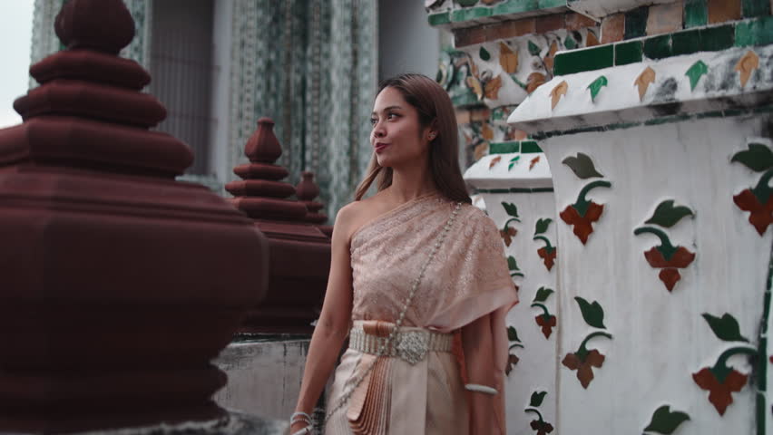 Thai women in traditional clothing at wat arun temple