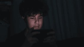 Irritated player reacts badly, Evening gaming causes visible frustration, Player experiences anger during late game sessions, Tense reactions observed in gamer during nocturnal game play - Powered by Shutterstock - Get 15% off with code: PIKWIZARD15