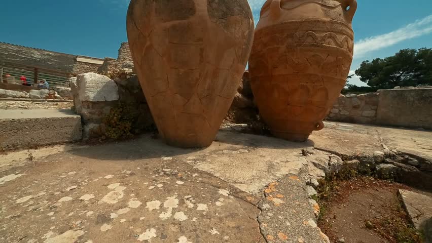Crane shot of two giant pithoi at the Minoan Palace of Knossos in Heraklion, Crete, showcasing ancient Greek architecture and history.
