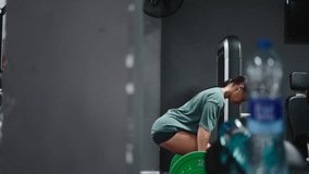 Strong woman performing deadlifts with barbell in gym - Powered by Shutterstock - Get 15% off with code: PIKWIZARD15