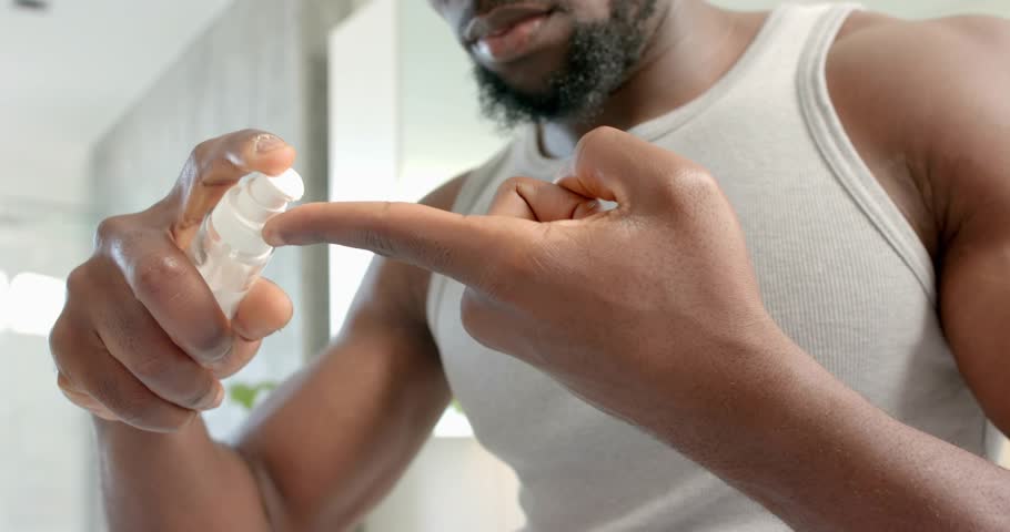 Man pressing pump, dispensing product at sink, rubbing beard while HUD indicating skincare progress. Facial, bathroom, mirror, overlay, circles, numbers, selfcare
