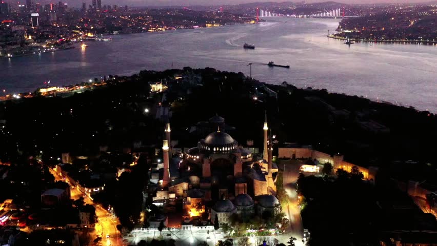 Aerial view of Hagia Sophia and Istanbul skyline at night with city lights