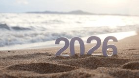 number 2026 for new year sign on summer beach at sunset time, with ripple sea wave and beautiful nature at background, 2026 New Year celebration concept - Powered by Shutterstock - Get 15% off with code: PIKWIZARD15