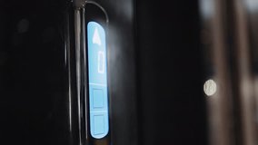 Businessman hand pressing elevator call button down on a touchscreen control interface in luxury modern loby - Powered by Shutterstock - Get 15% off with code: PIKWIZARD15