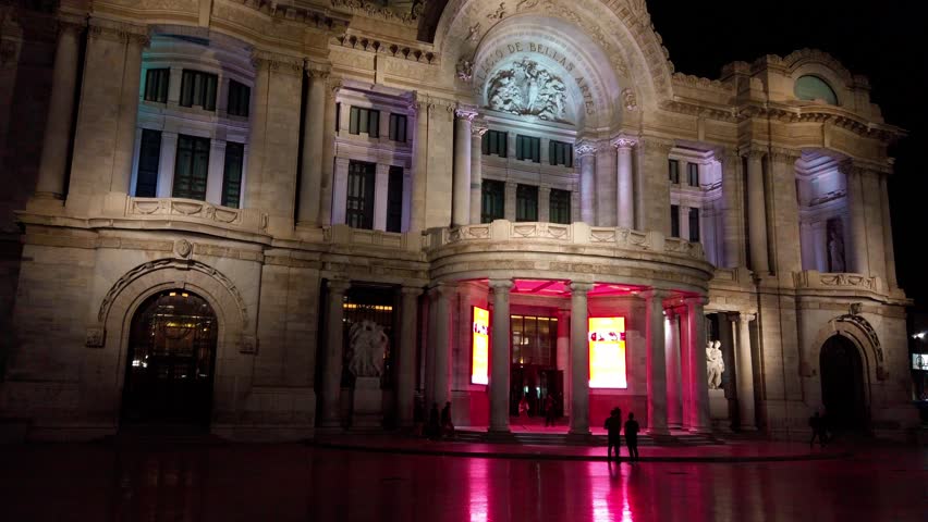 Night view of Palacio de Bellas Artes, vibrant lights, Mexico City