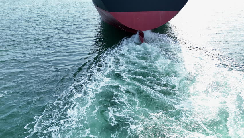 Propeller of large ship underwater spinning power working and water splash contrail . Close up image detail of Propeller ship, Logistics Transportation industry express technology of ship. Freight