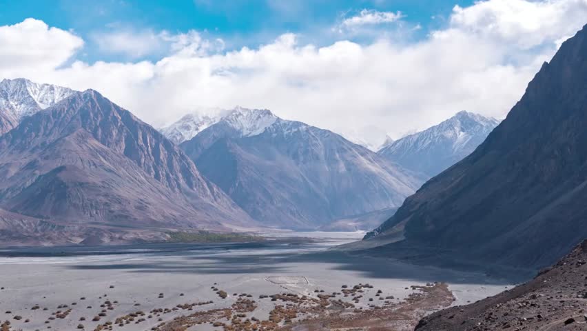 Majestic mountains under a blue sky with clouds in a scenic landscape view