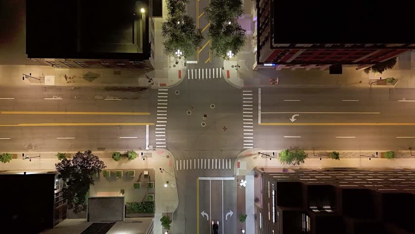 Timelapse aerial of Ann Arbor street intersection with traffic at night