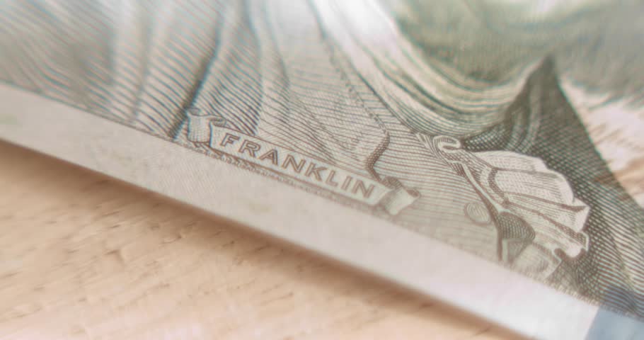 Macro view of Benjamin Franklin portrait on the 100 dollar bill