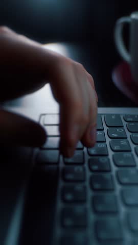 Hands actively typing on laptop keyboard