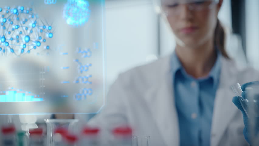 Female Scientist Carefully Pipettes Liquid Between Test Tubes While Monitoring Futuristic Holographic Medical Data, Advanced Pharmaceutical Research, Drug Development, Biotechnology Innovation