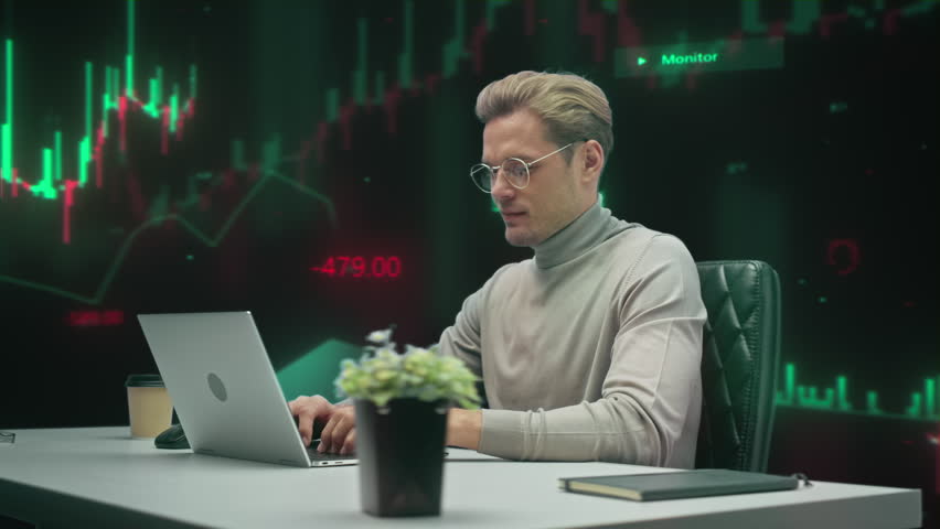 Financial Trader Analyzes Live Candlestick Charts on Multiple Screens, Executing Stock Market Strategies, Monitoring Volatility, and Managing Digital Investments. 360 Degree Tracking Arc Shot