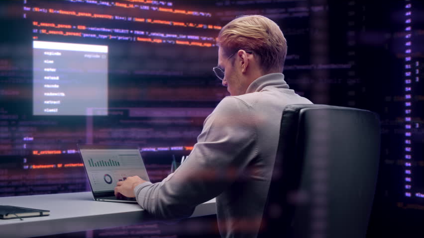 Cybersecurity Engineer Works on Laptop in Office, Surrounded by Code Screens, Detecting Intrusion, Analyzing Hacked System Logs, and Securing Compromised Network Data. 360 Degree Tracking Arc Shot