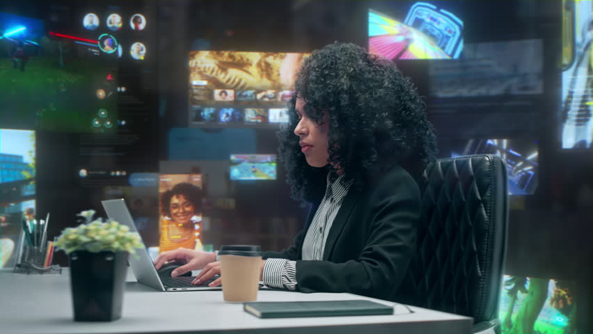 Smiling Young Black Woman Social Media Manager Works on Laptop in Office. Internet Use Concept with Immersive Feeds, Analytics Dashboards, Video Games and Content. 360 Degree Tracking Arc Shot