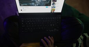 Woman in a Cozy Neon Bedroom Browses Social Media and Streaming Sites on Her Laptop, Surrounded by Floating Digital Immersive Online Content, Entertainment. Rotating Cinematic Robot Camera Movement - Powered by Shutterstock - Get 15% off with code: PIKWIZARD15