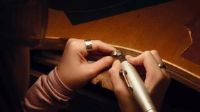 Hands jewelry ring polishing with rotary tool in workshop, closeup of artisan craft metalwork, filing and finishing of band on bench for custom accessory - Powered by Shutterstock - Get 15% off with code: PIKWIZARD15