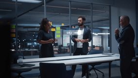 Diverse Team of Engineers Collaborates in Office, Using Mixed Reality Holograms to Inspect Detailed Turbine Engine Model, Discussing Virtual Prototyping, Innovation for Advanced Industrial Engineering - Powered by Shutterstock - Get 15% off with code: PIKWIZARD15