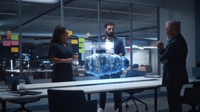 Diverse Team of Engineers Collaborates in Office, Using Mixed Reality Holograms to Inspect Detailed Turbine Engine Model, Discussing Virtual Prototyping, Innovation for Advanced Industrial Engineering - Powered by Shutterstock - Get 15% off with code: PIKWIZARD15