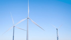 Green energy. Renewable energy sources. Wind turbine rotation. Wind power plant. Environmental care. Green electricity generation. Wind turbine rotation. - Powered by Shutterstock - Get 15% off with code: PIKWIZARD15