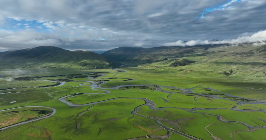Beautiful curving rivers and green grassland in Litang county, China