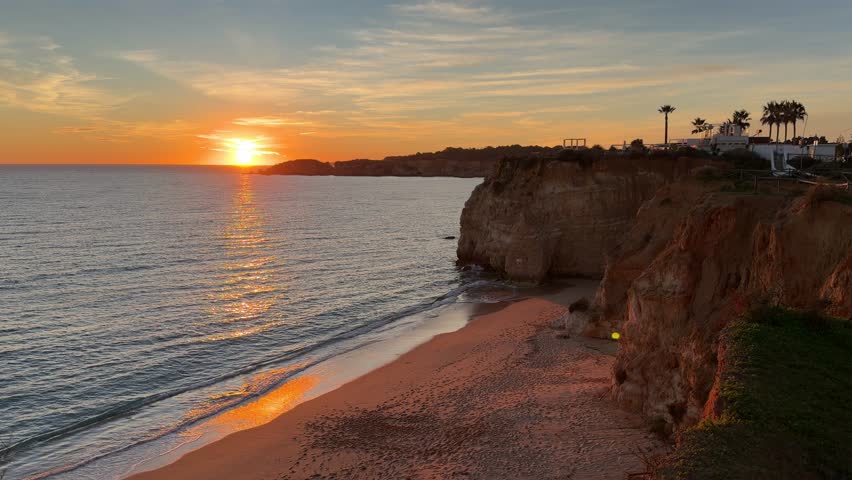 Beach Praia do Vau near the city Portimao at sunset. Algarve region, southern Portugal
