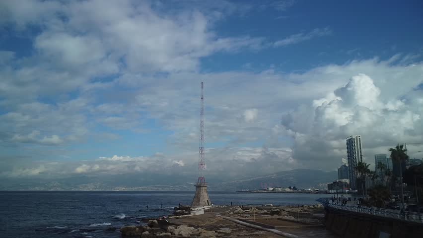 A stunning 4K aerial drone view of the Beirut waterfront, showcasing the Mediterranean Sea, modern buildings, and the iconic coastline of Lebanon’s capital. Smooth cinematic flight capturing the beaut