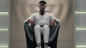 African American man putting on VR helmet in futuristic space modern innovative gadget technology using guy male put on virtual reality headset simulation experience modern futurism software for work - Powered by Shutterstock - Get 15% off with code: PIKWIZARD15