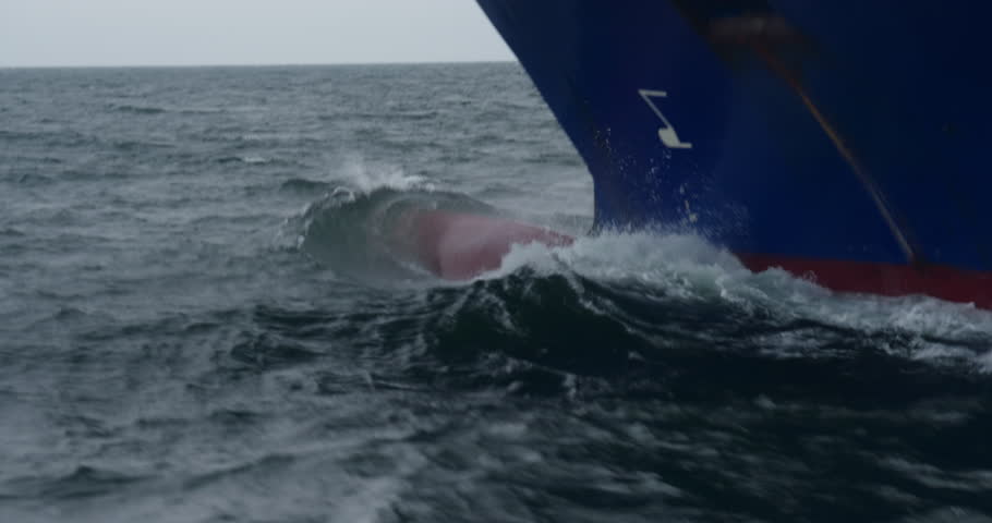 Ships bow cuts deep through water with hidden bulbous nose. Beneath waves bulb stabilizes and guides majestic motion. Hydrodynamic elegance