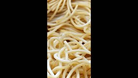Spaghetti texture, long wheat noodles, uncooked italian pasta, extreme close-up, vertical view - Powered by Shutterstock - Get 15% off with code: PIKWIZARD15
