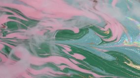 A stunning abstract background video with a liquid paint or marbling effect. Dusty pink and emerald green or teal dominate, flowing and interacting in subtle swirls and waves. - Powered by Shutterstock - Get 15% off with code: PIKWIZARD15