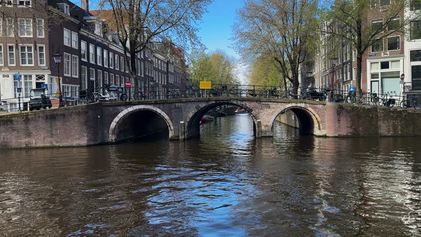 Facades of old historic Houses over canal water, Amsterdam, Netherlands