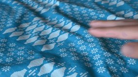 Slow motion video of a female hand straightening a blue duvet cover on a bed inside a hotel room with natural light. - Powered by Shutterstock - Get 15% off with code: PIKWIZARD15